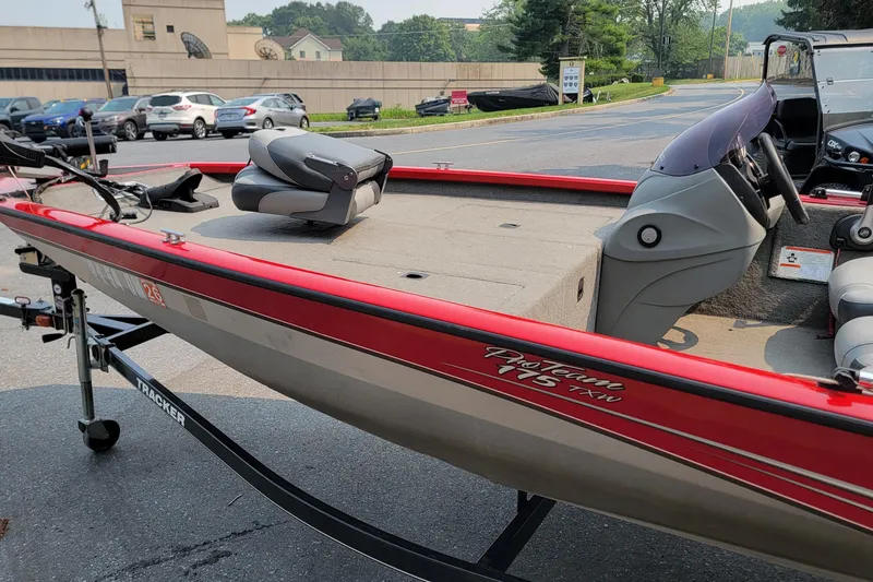 Slide: The Image of 2013 Tracker Pro Team 175 TXW boat on trailer, parked in a lot. - 5