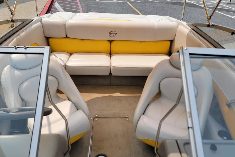 Slide: The Image of 2007 Crownline 19 SS boat interior with white and yellow seating, showcasing spacious design. - 12