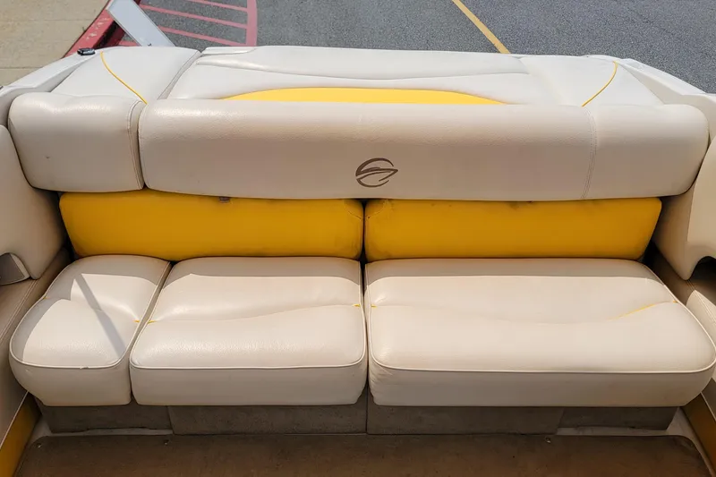 Slide: The Image of 2007 Crownline 19 SS boat interior with beige and yellow seating. - 9