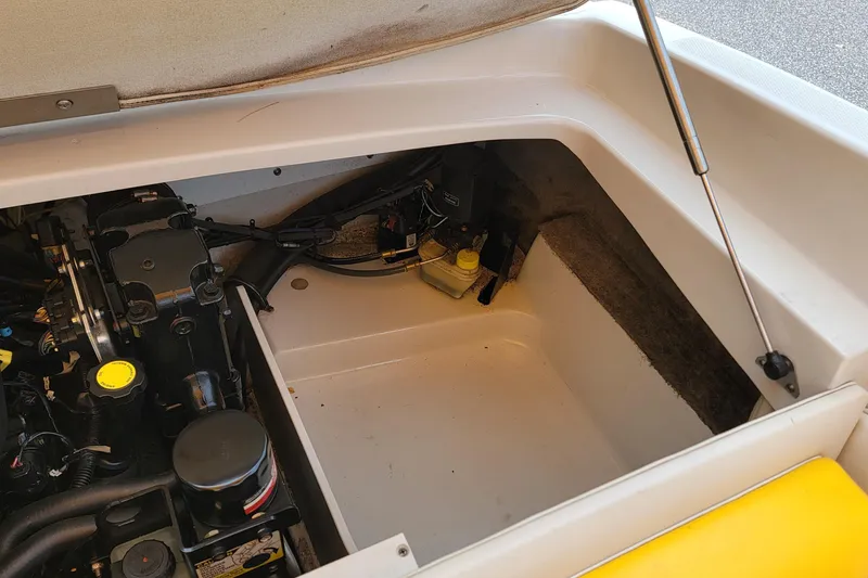 Slide: The Image of Open engine compartment of a 2007 Crownline 19 SS boat, showcasing mechanical components. - 7