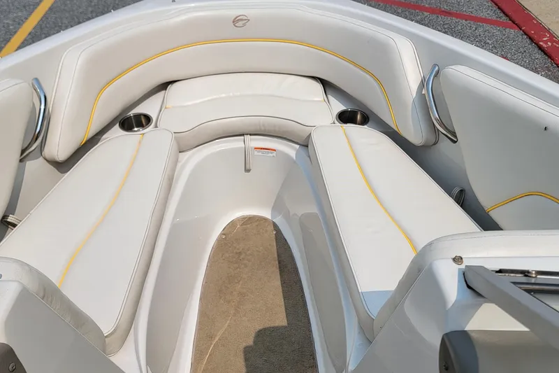 Slide: The Image of 2007 Crownline 19 SS boat interior with white seating and yellow accents. - 13