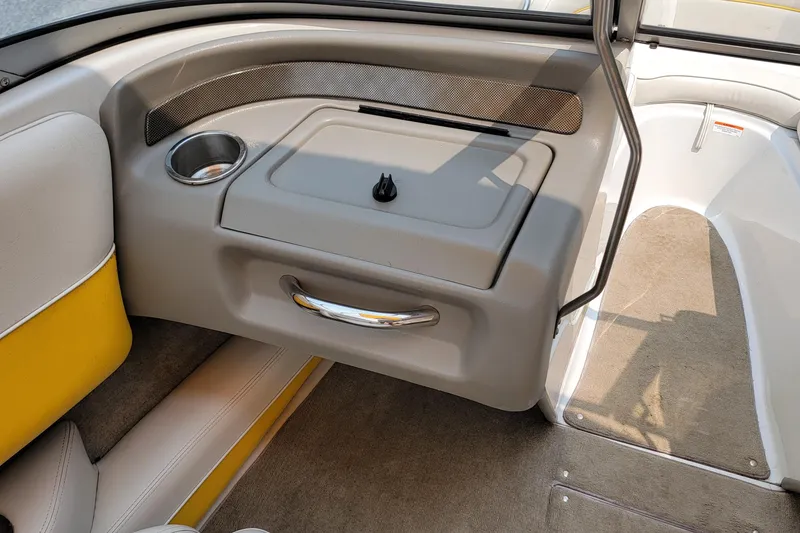 Slide: The Image of Interior of a 2007 Crownline 19 SS boat with cup holder and storage compartment. - 11