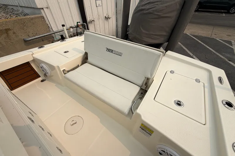 Slide: The Image of 2024 Pathfinder 2200 TRS boat interior with seating and storage compartments. - 18