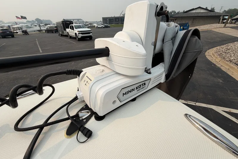 Slide: The Image of Minn Kota trolling motor on 2024 Pathfinder 2200 TRS boat in parking lot. - 16