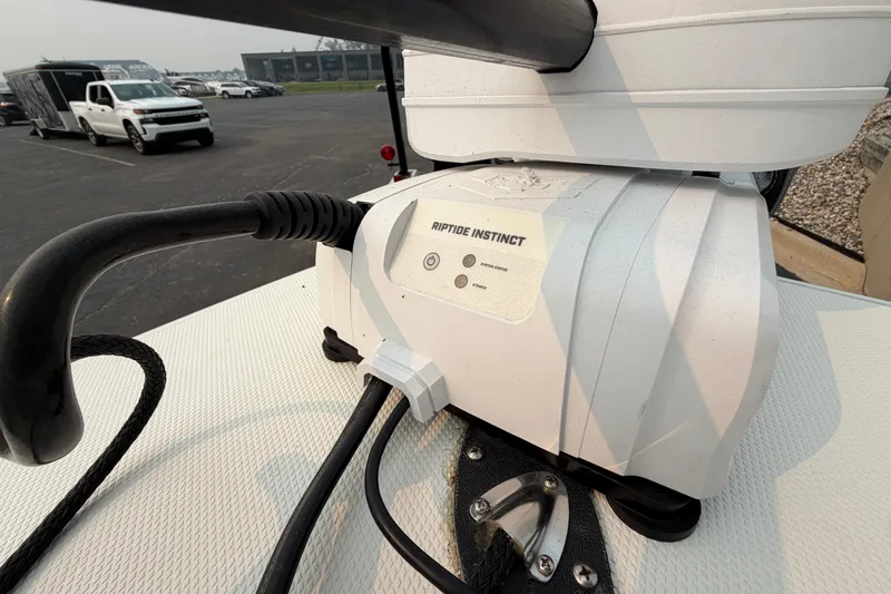 Slide: The Image of 2024 Pathfinder 2200 TRS boat with Riptide Instinct trolling motor in a parking lot. - 15
