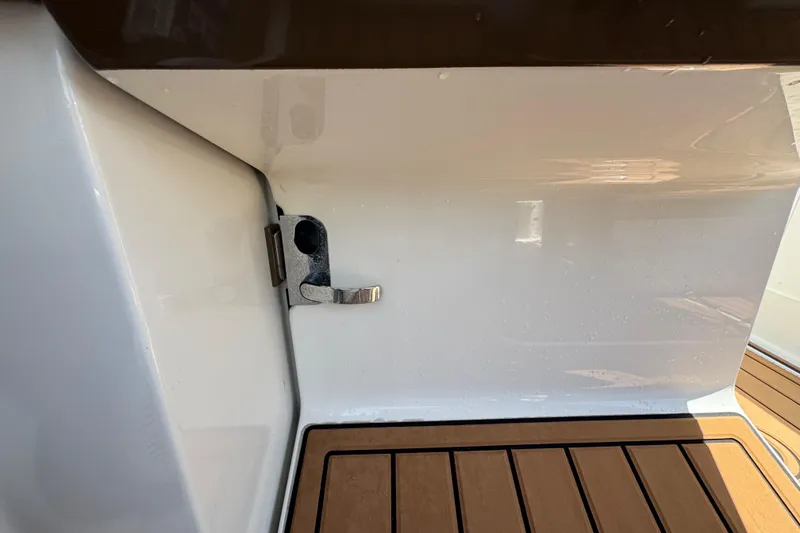 Slide: The Image of 2019 Formula 270 Bowrider interior detail with wooden flooring and metal latch. - 27