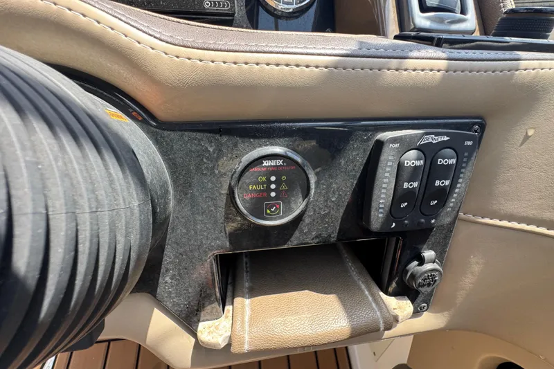 Slide: The Image of Control panel of a 2019 Formula 270 Bowrider boat with trim tab switches. - 37