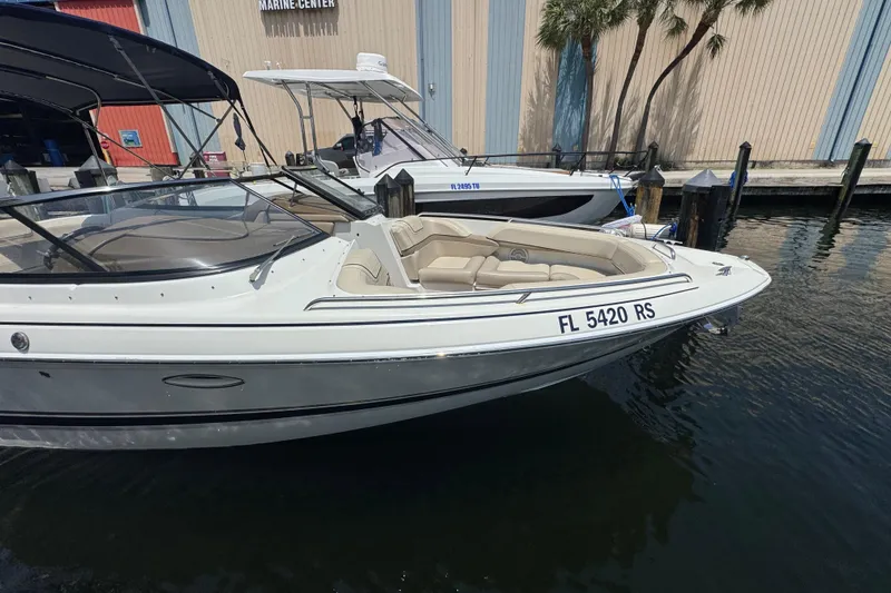 Slide: The Image of 2019 Formula 270 Bowrider boat docked at marina, featuring sleek design and comfortable seating. - 9