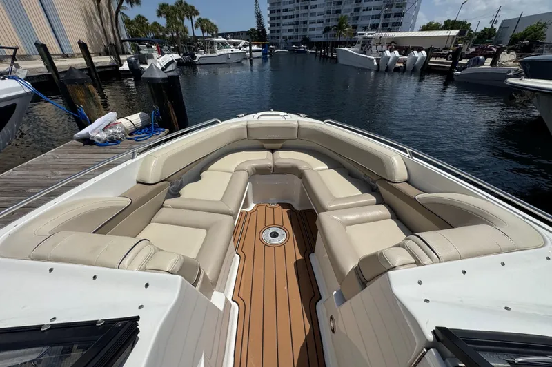 Slide: The Image of 2019 Formula 270 Bowrider with beige seating, docked at a marina. - 43