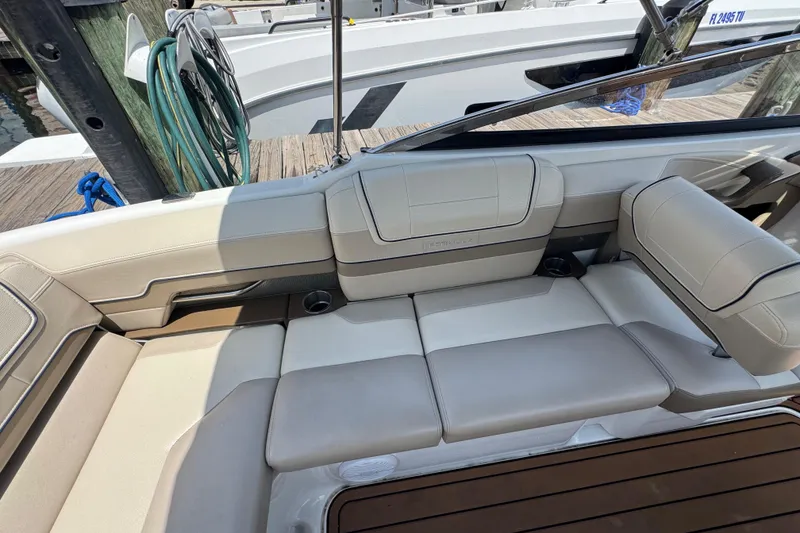 Slide: The Image of 2019 Formula 270 Bowrider interior with beige seating and cup holders. - 21