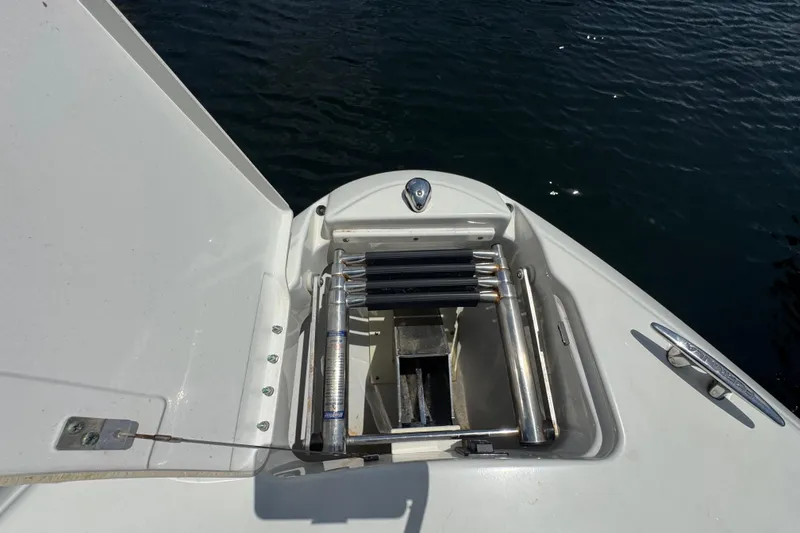 Slide: The Image of 2019 Formula 270 Bowrider swim platform ladder, stainless steel, on calm water. - 45