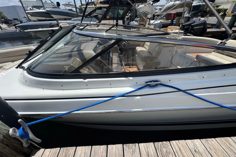 Slide: The Image of 2019 Formula 270 Bowrider docked at marina, featuring sleek design and comfortable seating. - 12