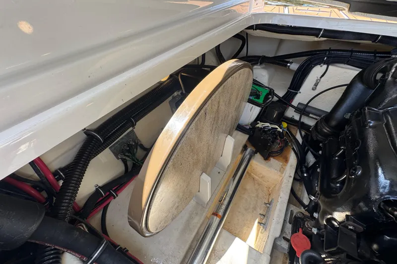 Slide: The Image of Engine compartment of a 2019 Formula 270 Bowrider boat, showcasing wiring and components. - 57