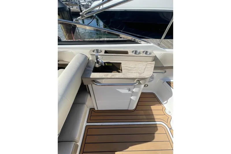 Slide: The Image of 2019 Formula 270 Bowrider interior with sink and wooden flooring. - 8