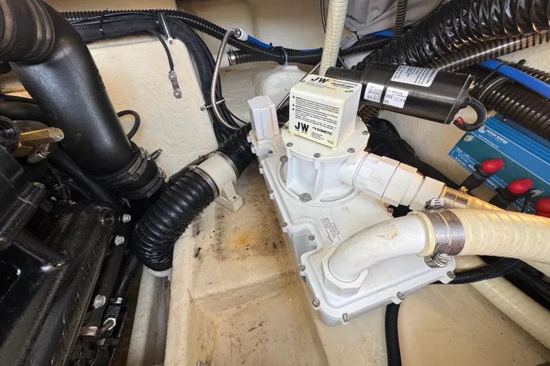 Slide: The Image of Engine compartment of a 2019 Formula 270 Bowrider with visible hoses and components. - 55