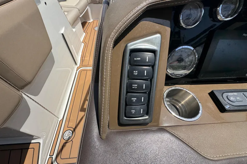 Slide: The Image of Dashboard controls of a 2019 Formula 270 Bowrider boat with switches and gauges. - 35