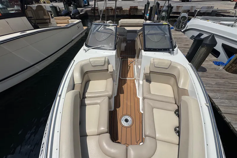Slide: The Image of 2019 Formula 270 Bowrider boat with spacious seating and sleek design at dock. - 48