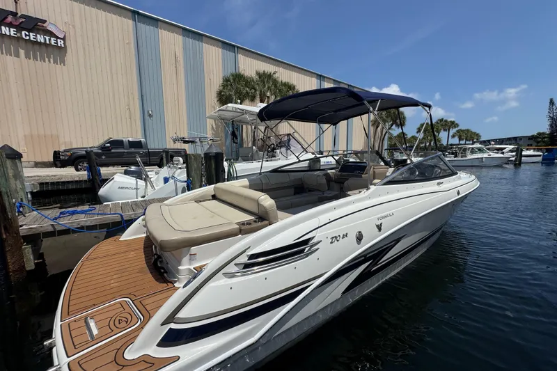 The Image of 2019 Formula 270 Bowrider docked at marina, featuring sleek design and spacious seating. - 5