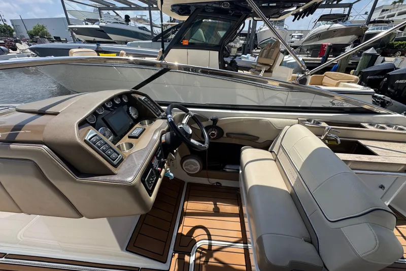 Slide: The Image of Interior view of a 2019 Formula 270 Bowrider boat with modern dashboard and seating. - 32
