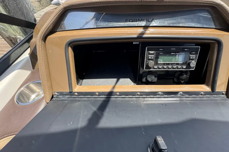 Slide: The Image of Dashboard of a 2019 Formula 270 Bowrider with audio system and cup holder. - 26
