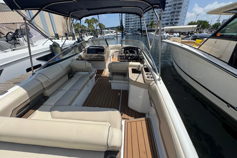 Slide: The Image of 2019 Formula 270 Bowrider boat interior with spacious seating and modern dashboard. - 17