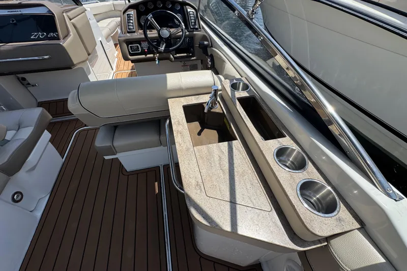 Slide: The Image of Luxurious 2019 Formula 270 Bowrider interior with sleek dashboard and elegant seating. - 18