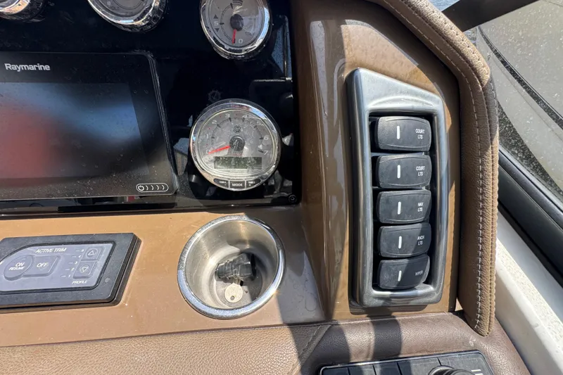 Slide: The Image of Dashboard of a 2019 Formula 270 Bowrider boat with gauges and control switches. - 34