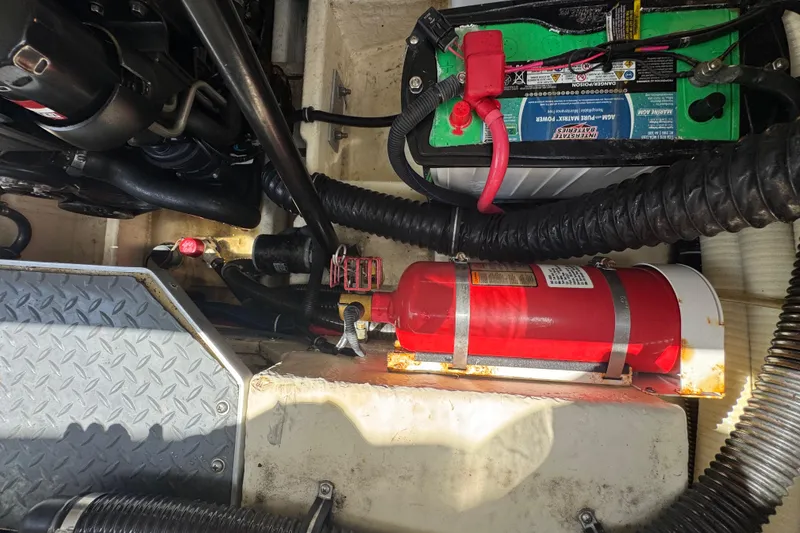 Slide: The Image of Engine compartment of 2019 Formula 270 Bowrider with battery and fire extinguisher. - 52