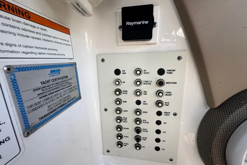 Slide: The Image of Control panel of a 2019 Formula 270 Bowrider boat with various switches and certifications. - 38