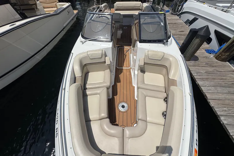 Slide: The Image of 2019 Formula 270 Bowrider with spacious seating and sleek design docked at marina. - 47
