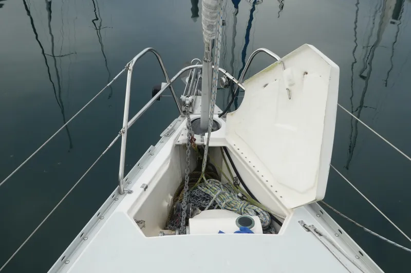Slide: The Image of Open anchor locker on 1992 Hunter Passage 42 sailboat, showing ropes and chains. - 5