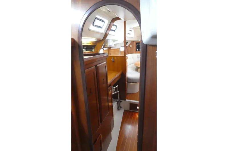 Slide: The Image of Interior of 1992 Hunter Passage 42 yacht with wooden cabinetry and seating area. - 27