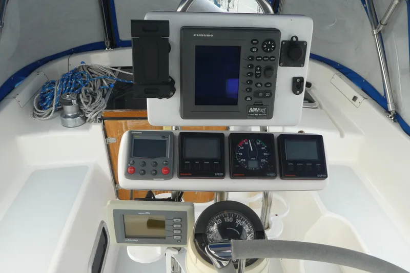 Slide: The Image of Cockpit of 1992 Hunter Passage 42 sailboat with navigation instruments and steering wheel. - 7
