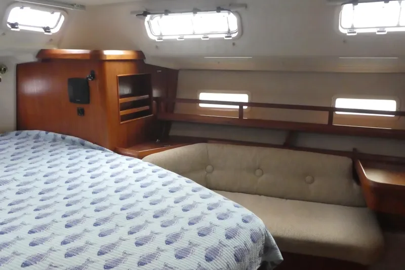 Slide: The Image of Interior of 1992 Hunter Passage 42 yacht with cozy bed and seating area. - 24