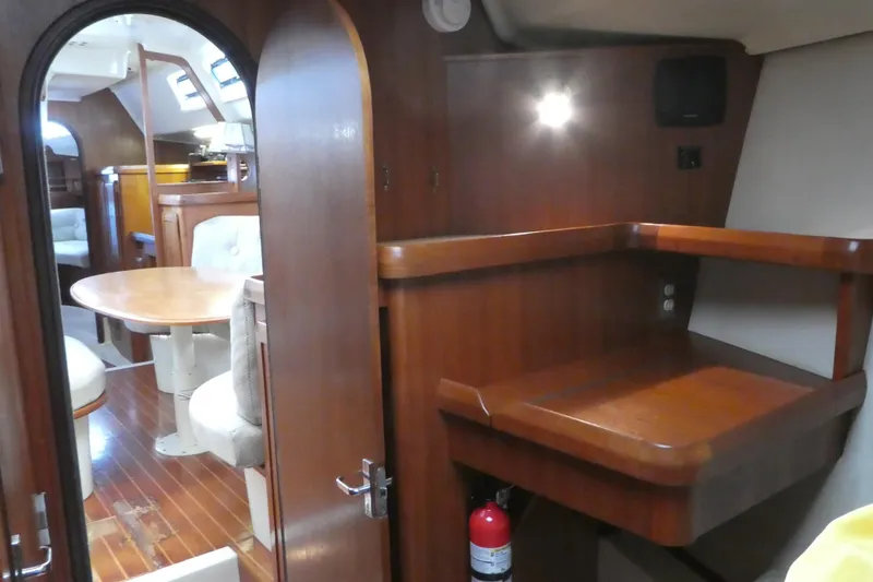 Slide: The Image of Interior of 1992 Hunter Passage 42 yacht with wooden furnishings and dining area. - 30