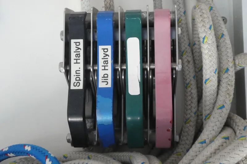 Slide: The Image of Color-coded halyard blocks on a 1992 Hunter Passage 42 sailboat. - 8