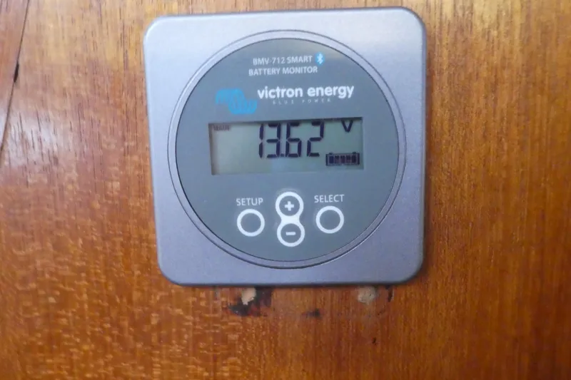 Slide: The Image of Victron Energy battery monitor displaying 13.62 volts on a 1992 Hunter Passage 42 yacht. - 39