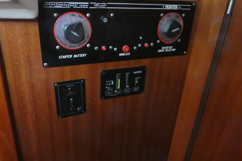 Slide: The Image of Control panel of a 1992 Hunter Passage 42 sailboat with battery and inverter switches. - 38