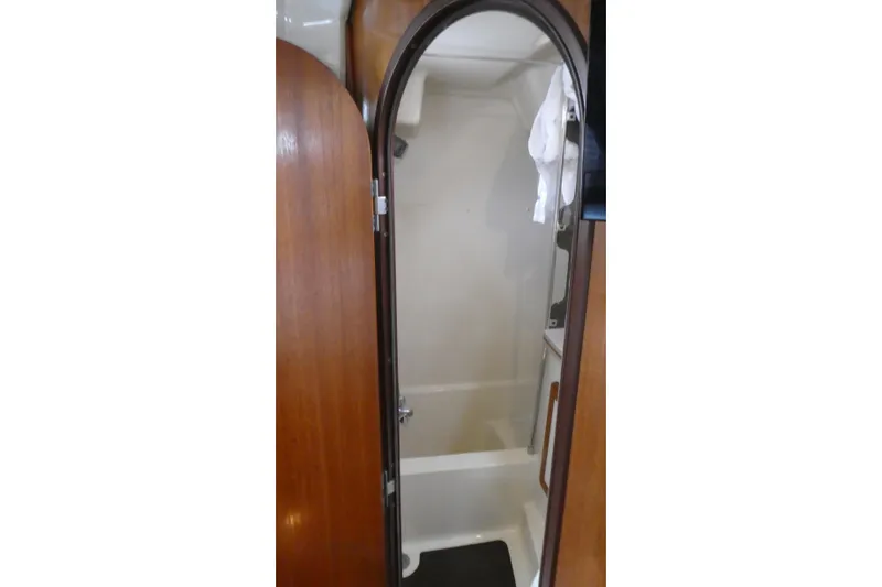 Slide: The Image of Shower area inside 1992 Hunter Passage 42 sailboat with wooden door. - 26