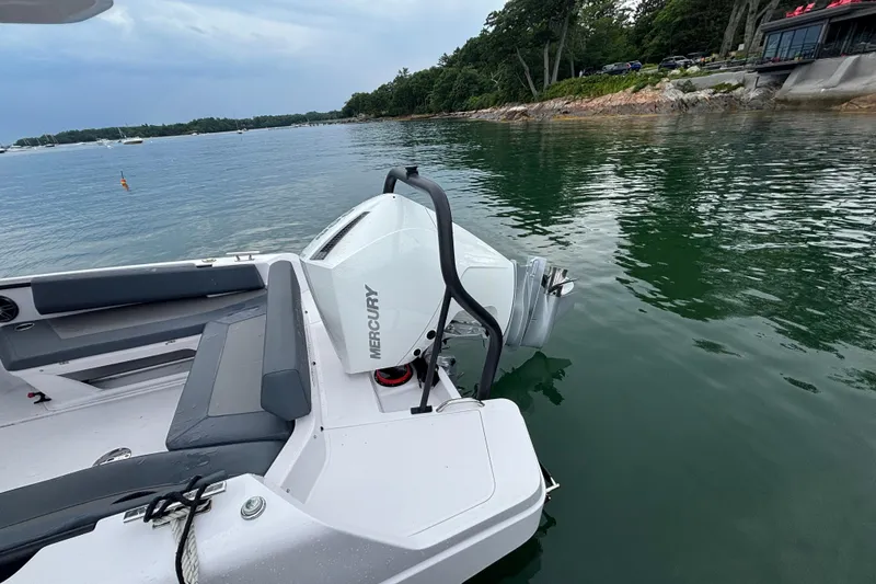 Slide: The Image of 2022 Axopar 22 T-Top boat with Mercury engine on calm water. - 17