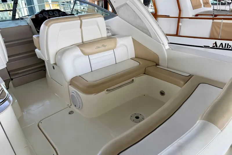 Slide: The Image of 2008 Sea Ray Sundancer 330 interior with beige and white seating. - 6