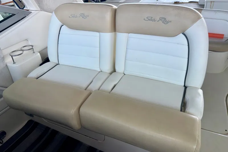 Slide: The Image of 2008 Sea Ray Sundancer 330 boat seating with beige and white upholstery. - 10