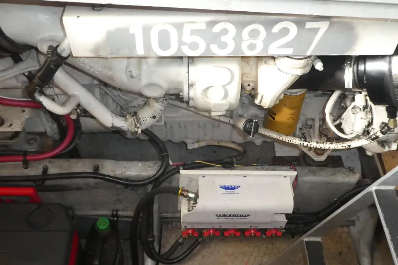 Slide: The Image of Engine compartment of a 1997 Silverton 41 Convertible boat, showcasing mechanical components. - 27