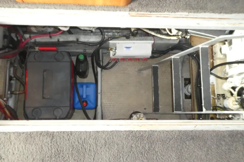 Slide: The Image of Engine compartment of a 1997 Silverton 41 Convertible boat, showing battery and wiring. - 23