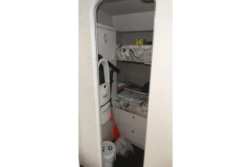 Slide: The Image of Interior of 1997 Silverton 41 Convertible with bunk beds and storage. - 17