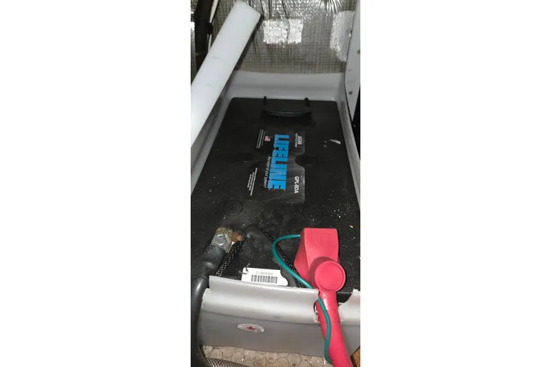 Slide: The Image of Battery compartment of a 1997 Silverton 41 Convertible boat with Lifeline battery. - 32