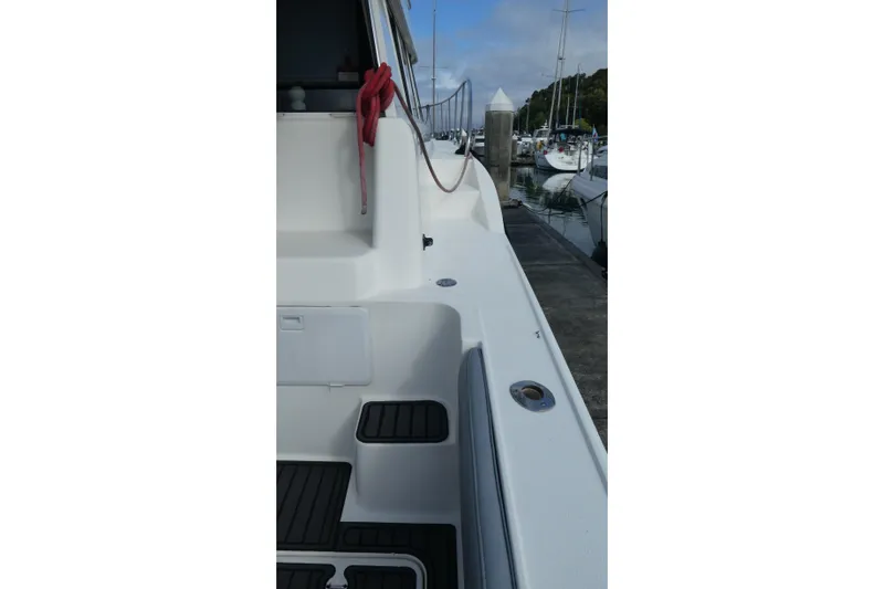 Slide: The Image of 1997 Silverton 41 Convertible yacht docked at marina, side view with clear sky. - 41