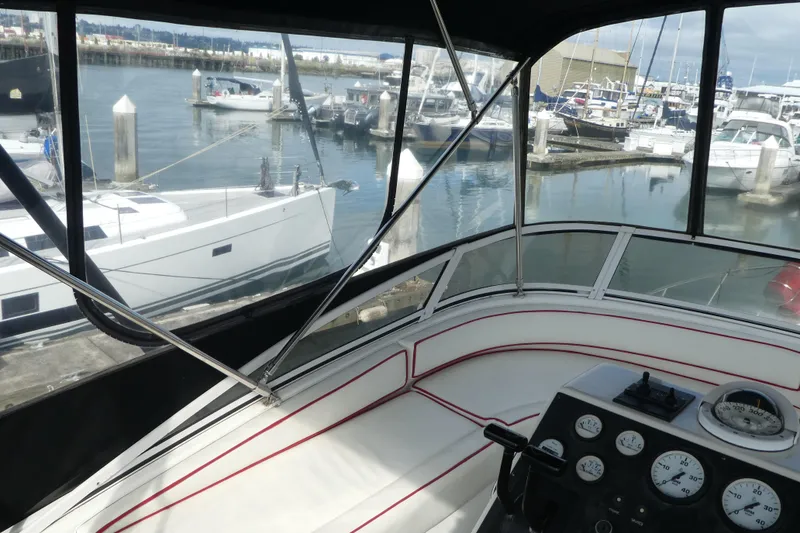 Slide: The Image of Cockpit view of 1997 Silverton 41 Convertible yacht docked at marina. - 37