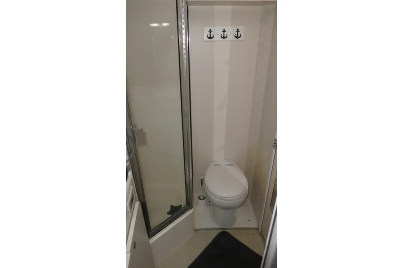 Slide: The Image of Bathroom interior of 1997 Silverton 41 Convertible yacht with shower and toilet. - 16
