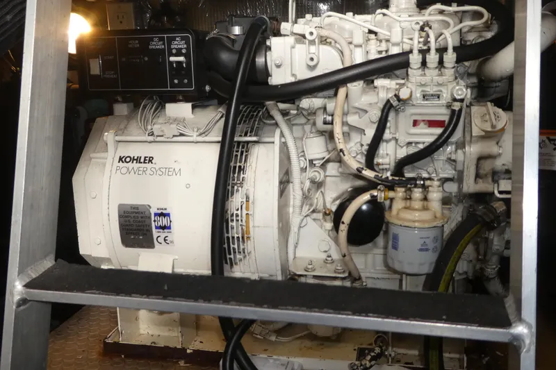 Slide: The Image of Engine room of a 1997 Silverton 41 Convertible with Kohler power system. - 24